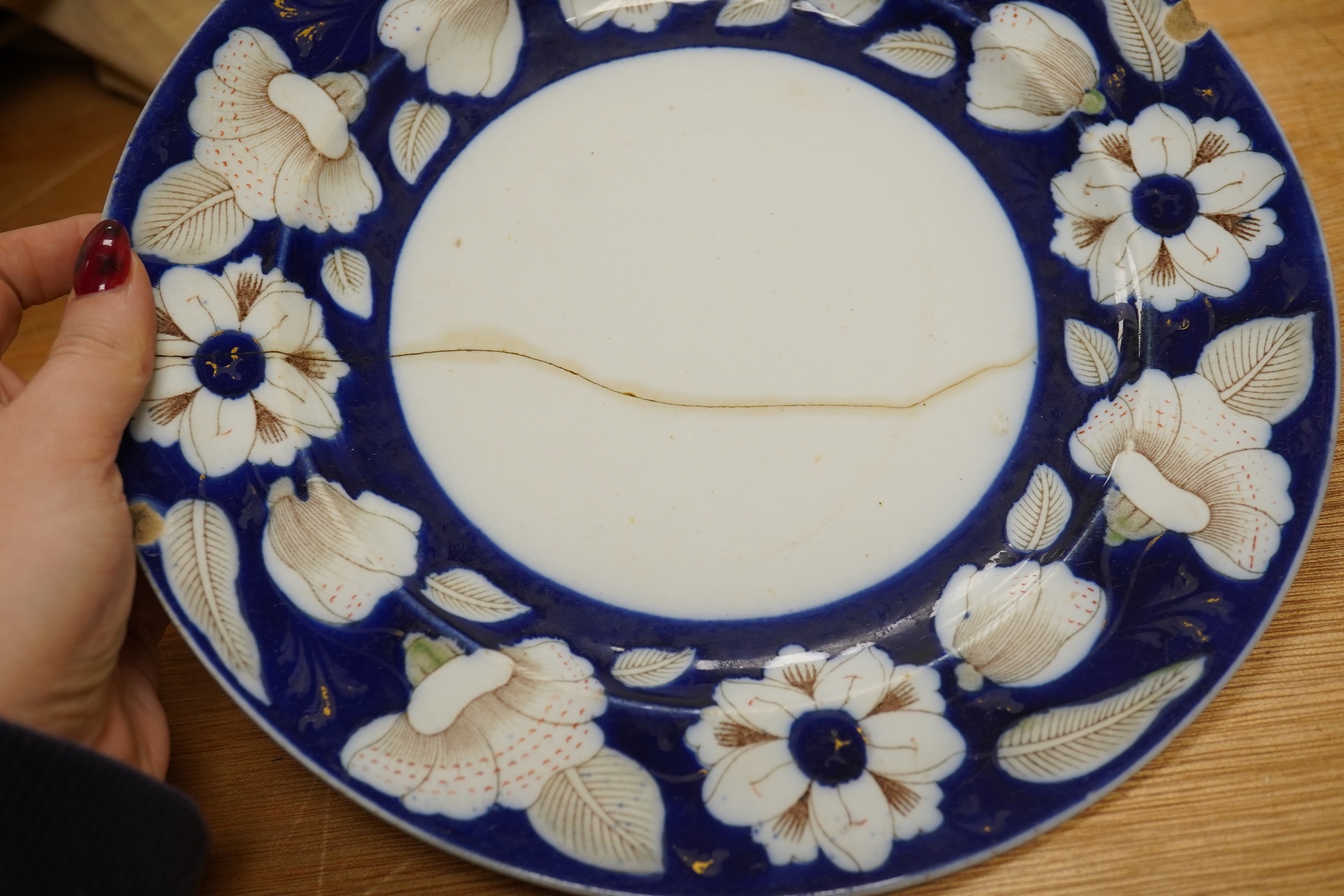 A Victorian Ironstone part set of floral decorated tableware. Condition - some items damaged